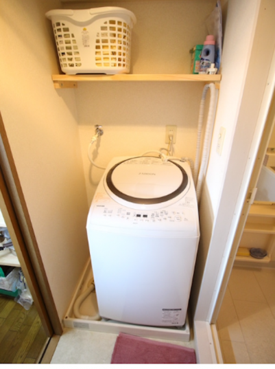 洗濯乾燥機。浴室からの湯を自動でポンプアップ。